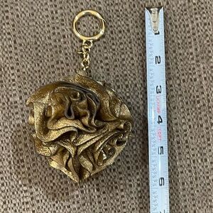 NWOT Michael Kors gold colored leather key fob/bag charm.